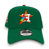 Green cap with colorful parrot design and 'H' logo on a white background