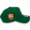 Green baseball cap with a '60 Years' logo on a white background