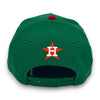 Green baseball cap with a logo on the back against a white background