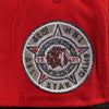 Close-up of a red cap with an embroidered logo featuring a star and text. 42nd ASG 59FIFTY Red New Era Hat
