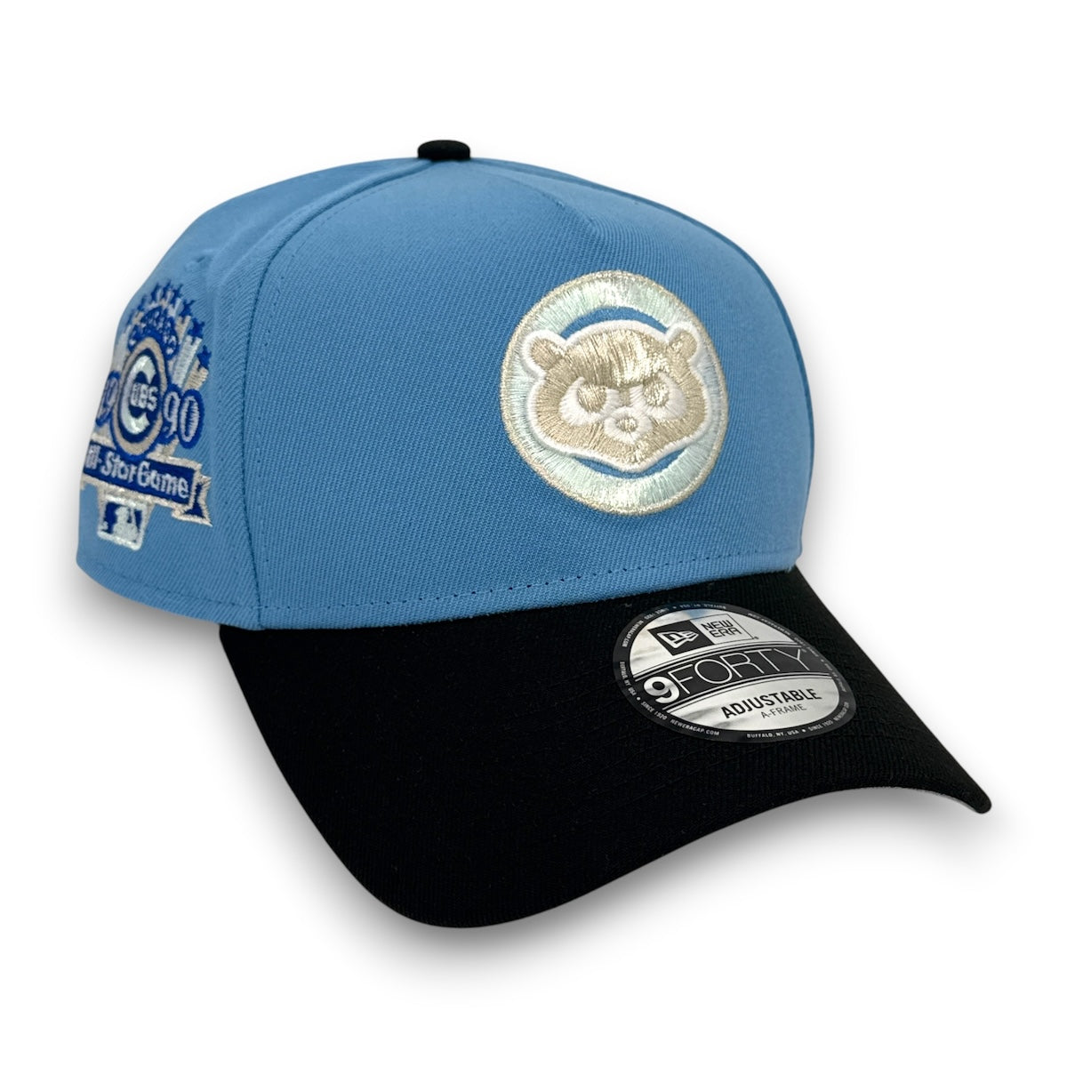 Blue and black baseball cap with embroidered logo on a white background