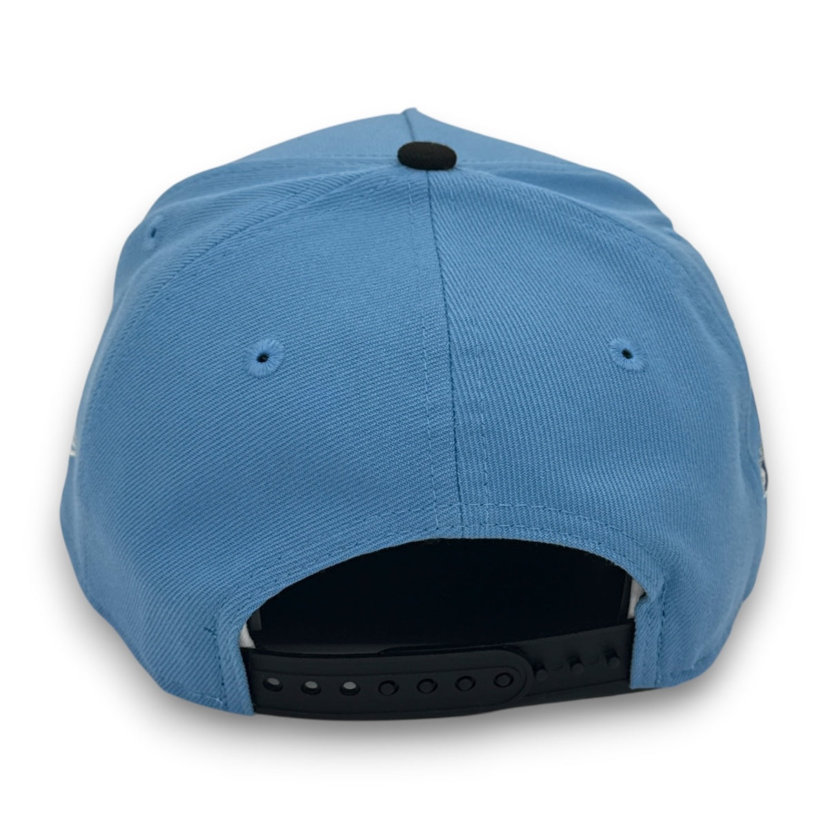 Blue cap with a black strap on a white background