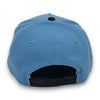 Blue cap with a black strap on a white background