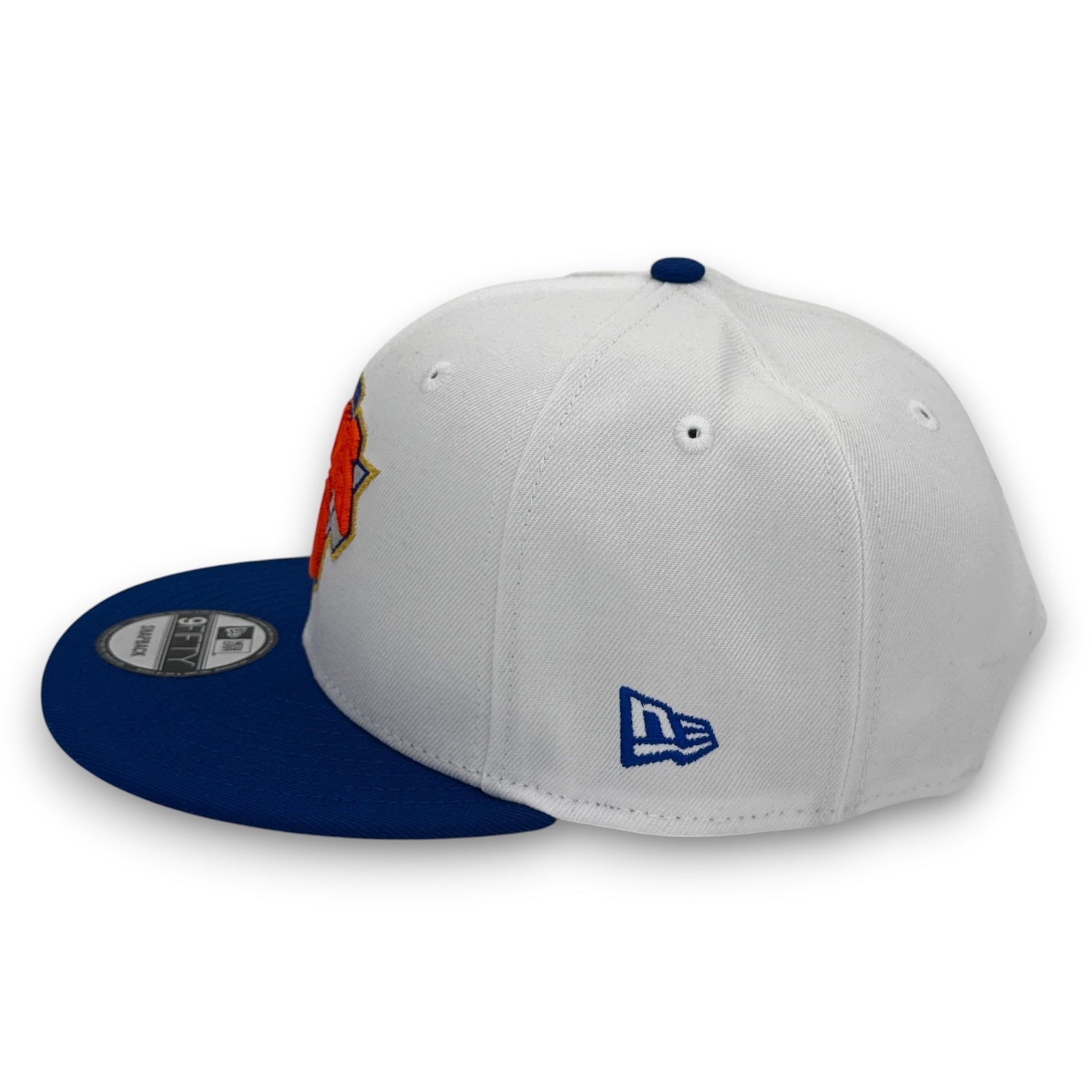 Two New Era caps, one white with blue brim and logo, the other blue with white brim and logo, on a white background.
