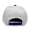 White cap with blue accents on a white background
