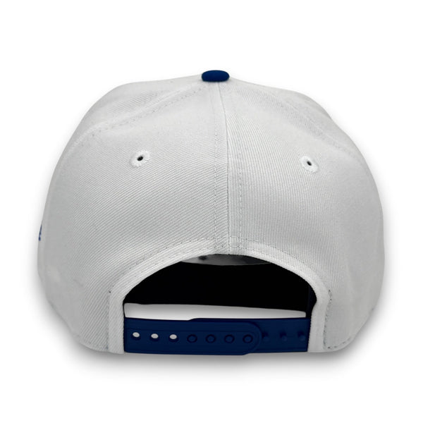 White cap with blue accents on a white background