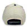 Beige cap with black interior and strap on a white background
