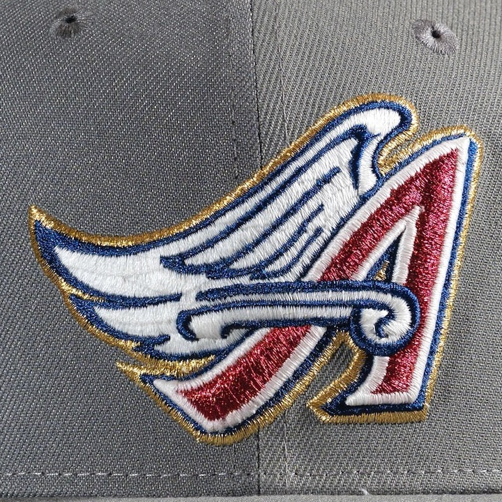 A logo with wings -Pinwheels Anaheim Angels 50th 59FIFTY New Era Hat