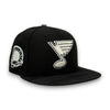 St. Louis Blues 40th 59FIFTY New Era Back Hat-A black flat-brim baseball cap featuring an embroidered white St. Louis Blues logo on the front and a circular white patch on the side, set against a plain white background.
