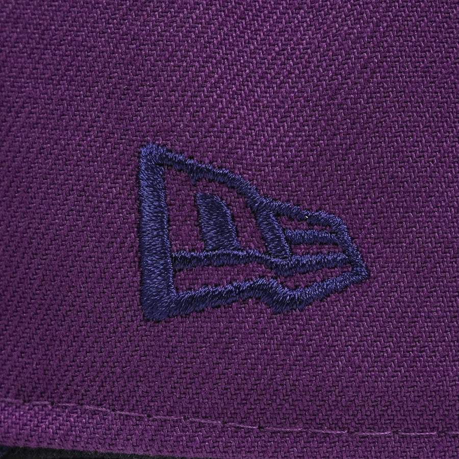 Close-up of a purple fabric with a brand logo embroidered on it.The Pirates Brooklyn 42 ASG 59FIFTY Grape New Era Hat The Pirates Brooklyn 42 ASG 59FIFTY Grape New Era Hat
