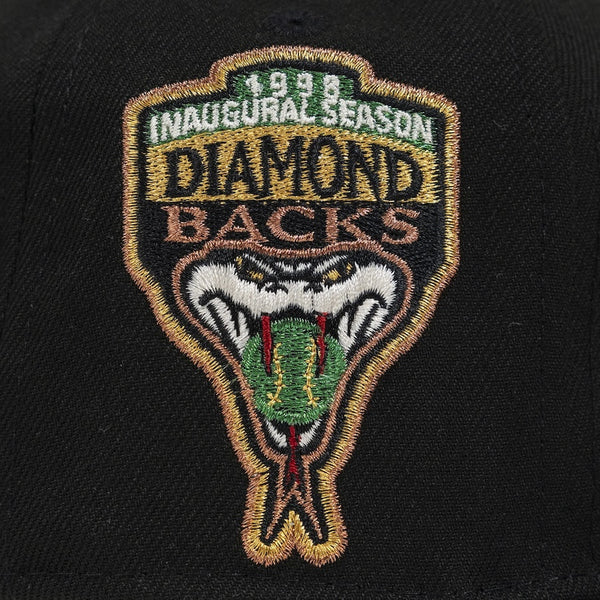 Embroidered patch on a black background with '1998 Inaugural Season Diamondbacks' text and snake design. The Pirates Dbacks 98 59FIFTY Black New Era Hat