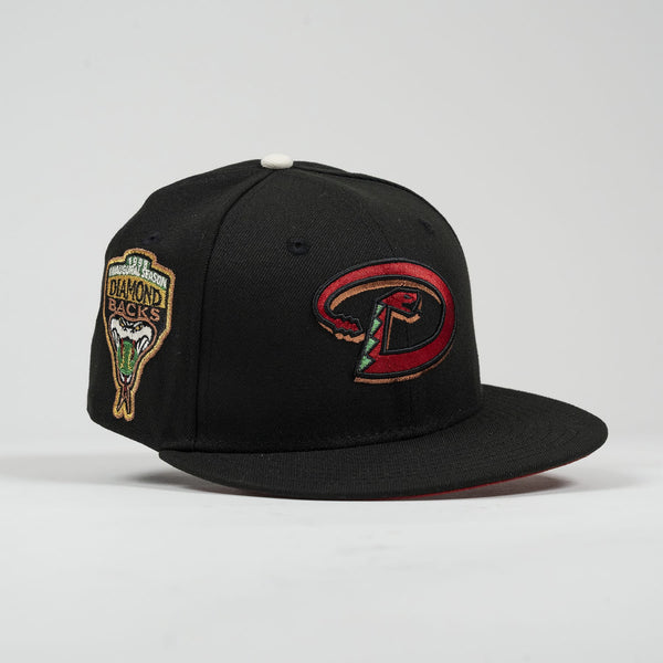Black baseball cap with logos on a light gray background- The Pirates Dbacks 98 59FIFTY Black New Era Hat