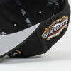 Black cap with a colorful logo on a light gray background. Bradenton Marauders