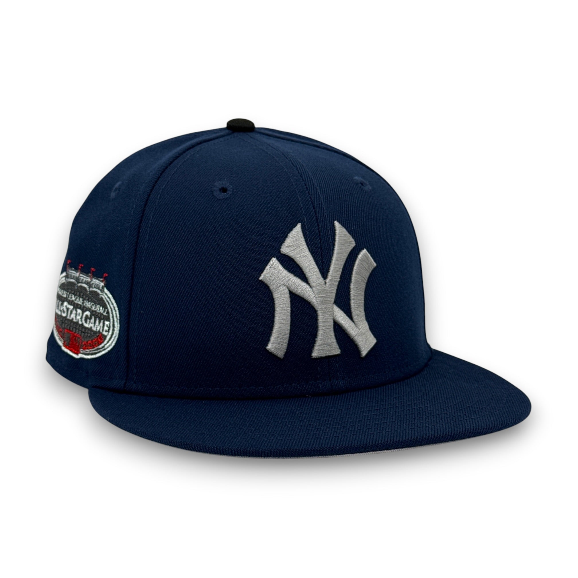 🧟‍♂️ Der Riese 🧟‍♂️ 10.20.26 2PM EST YANKEES 08 ASG BANNER.PNG A navy blue New York Yankees snapback cap featuring a silver embroidered NY logo on the front and a commemorative patch on the side, set against a plain white background.